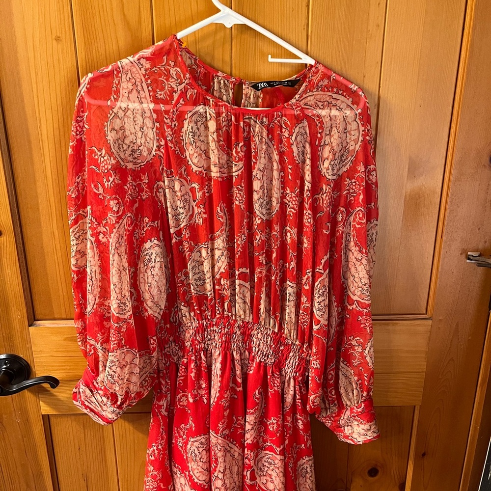 Zara dress. Lined at the skirt. You need to wear a camisole under the top